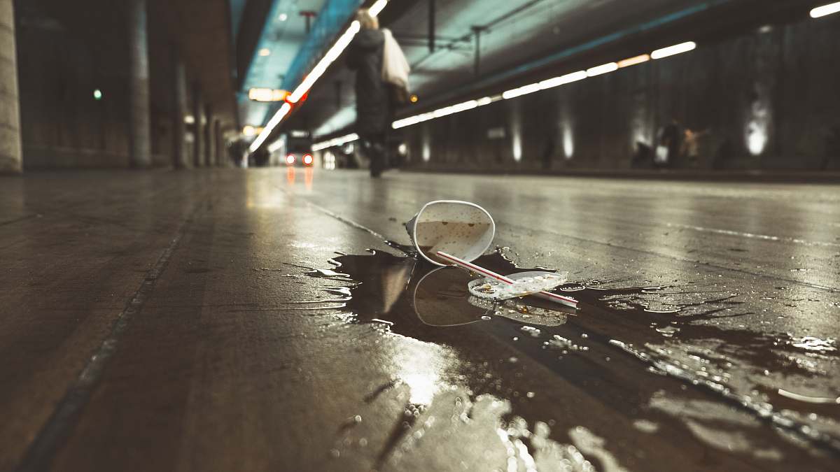the hague white paper cup spilled on road urban